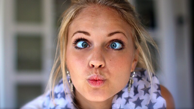 Woman Making Funny Face — White