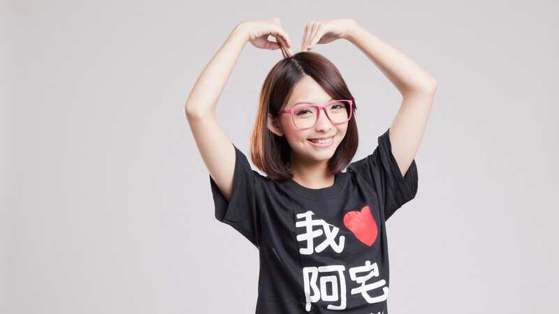woman making heart gesture