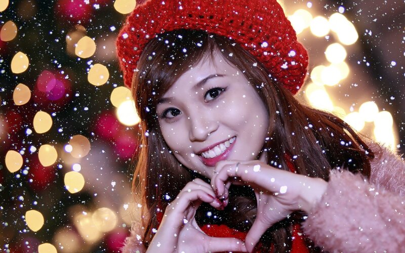woman making heart gesture