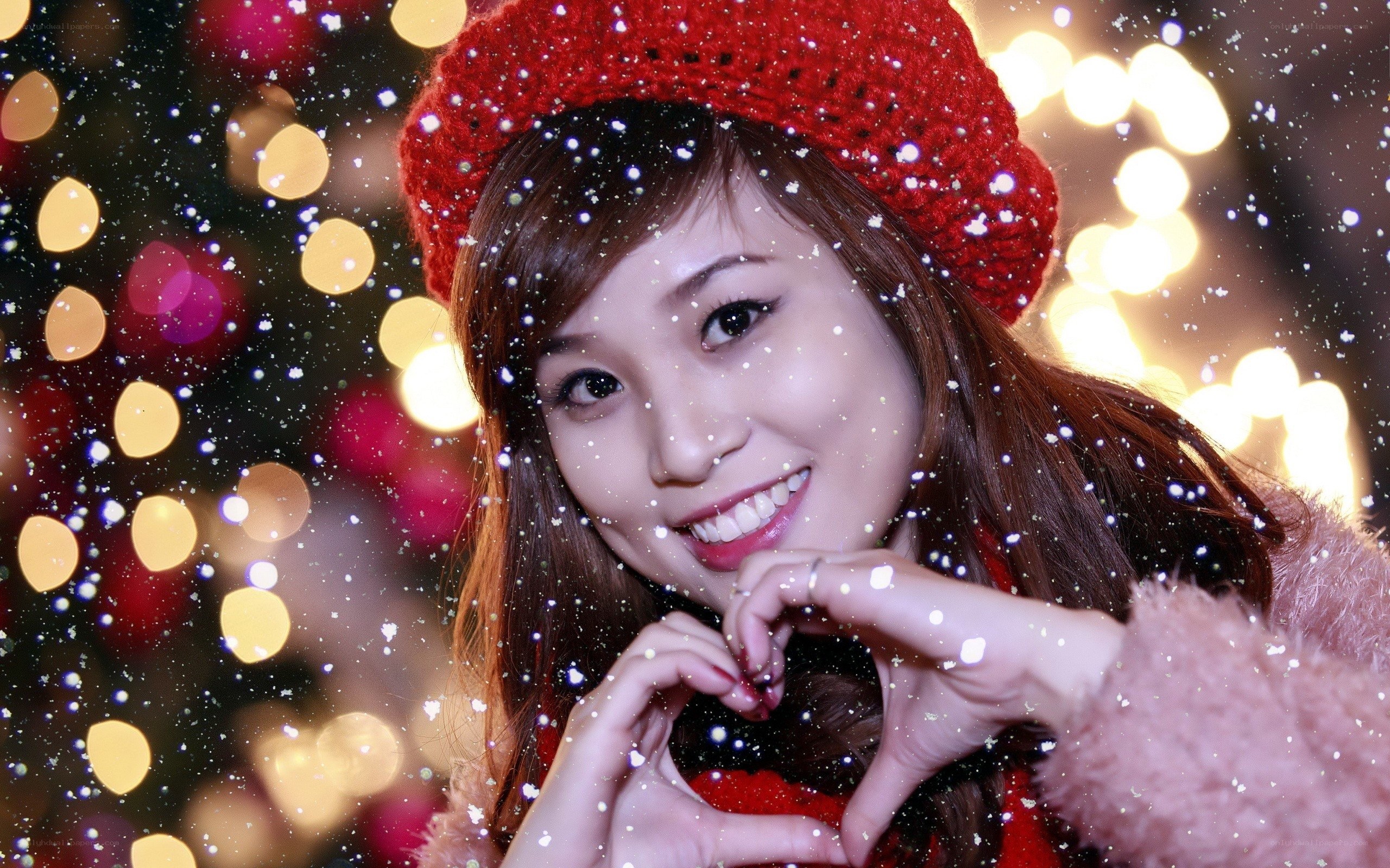 woman making heart gesture