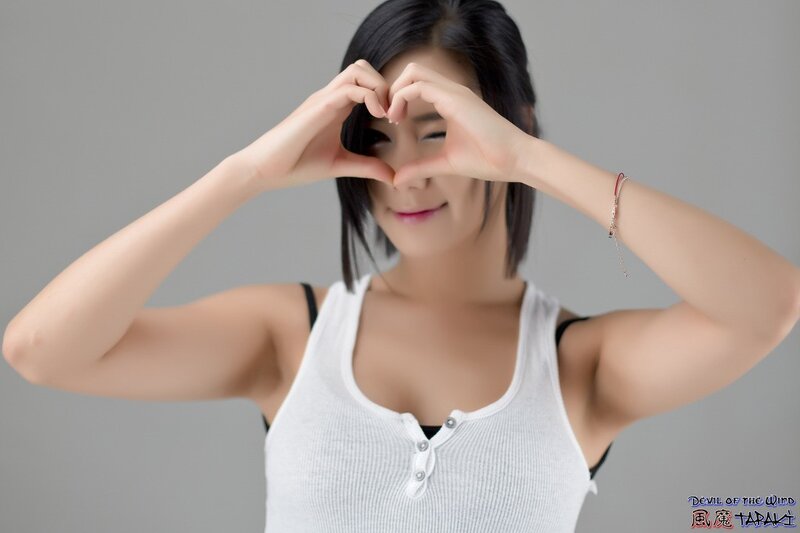 Woman Making Heart Shape — Gray