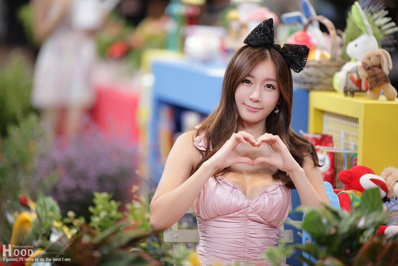 Woman Making Heart Shape — Pink, Playful