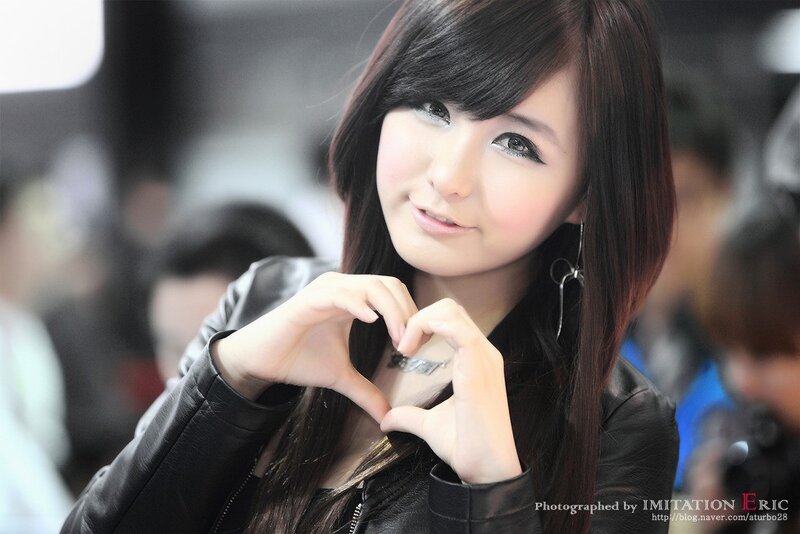 woman making heart shape with hands