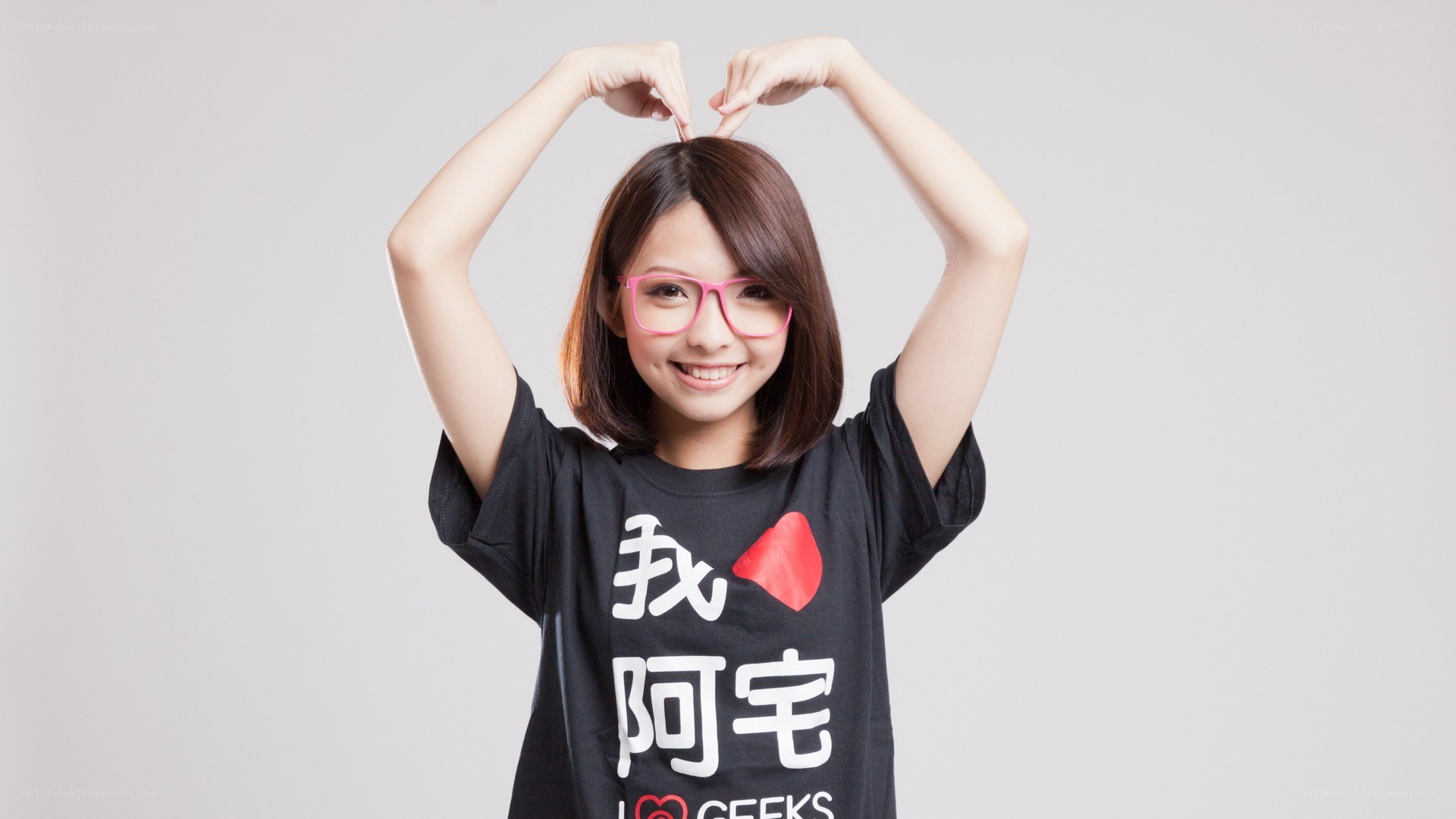 woman making heart shape with hands
