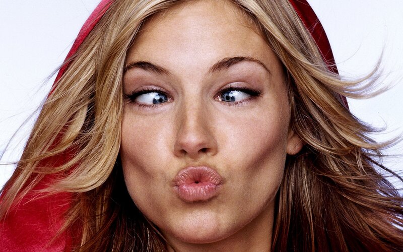 Woman Making Kiss Face — Red, Playful