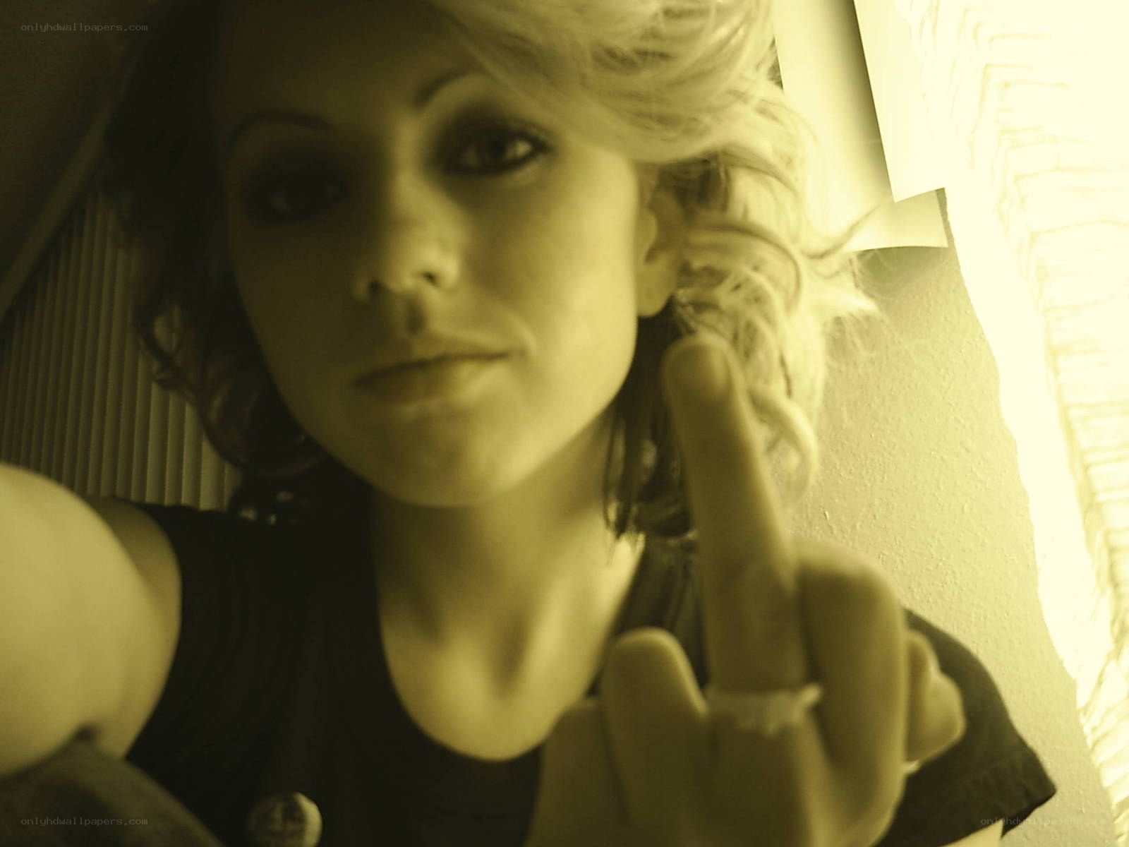 woman making middle finger gesture