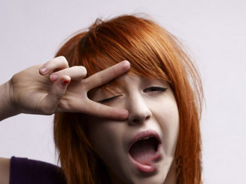 woman making peace sign