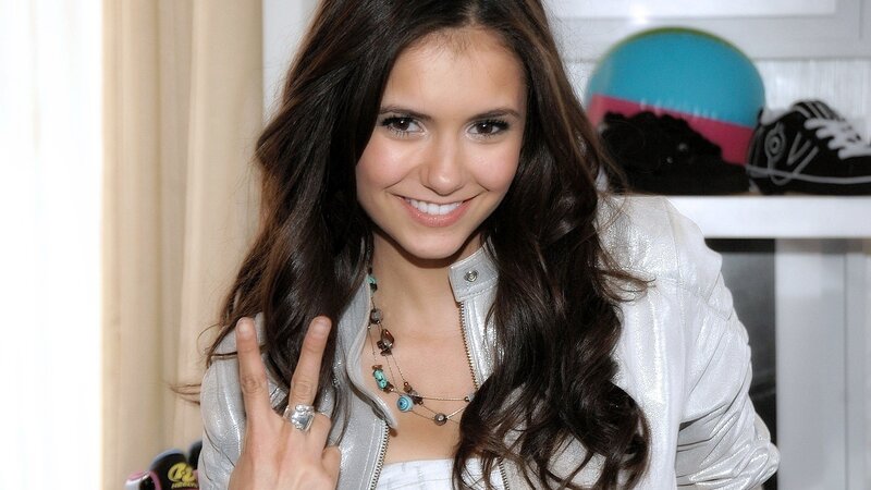 woman making peace sign