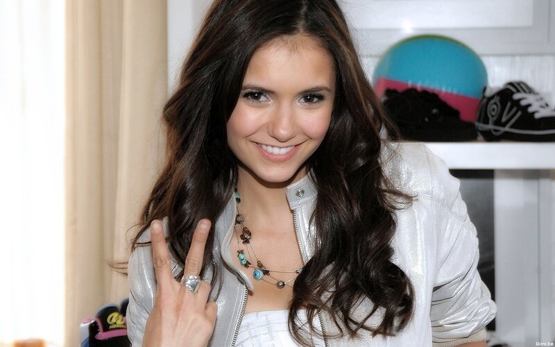 woman making peace sign
