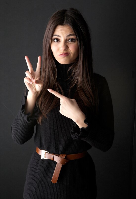 woman making peace sign