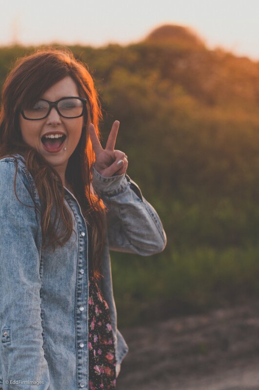 woman making peace sign