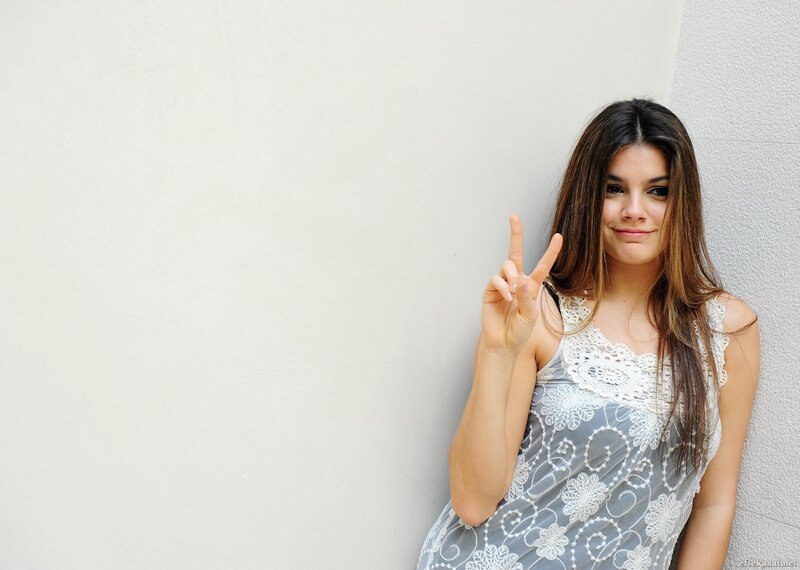 woman making peace sign