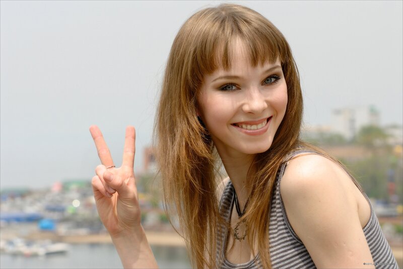 woman making peace sign