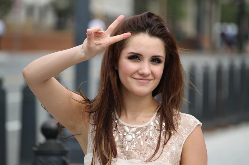 woman making peace sign