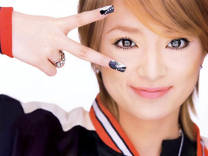 woman making peace sign