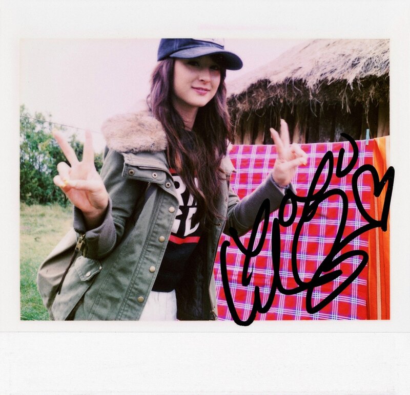woman making peace signs