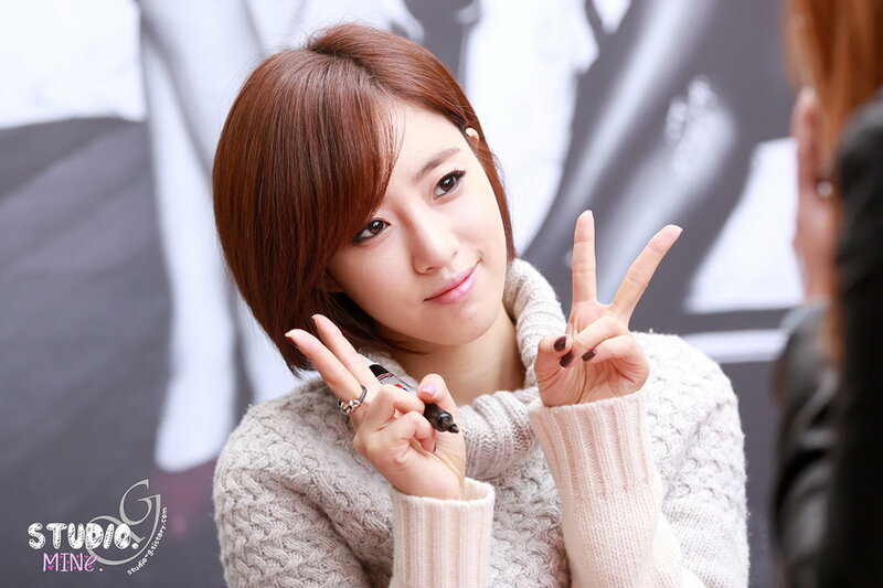 Woman Making Peace Signs — Brown
