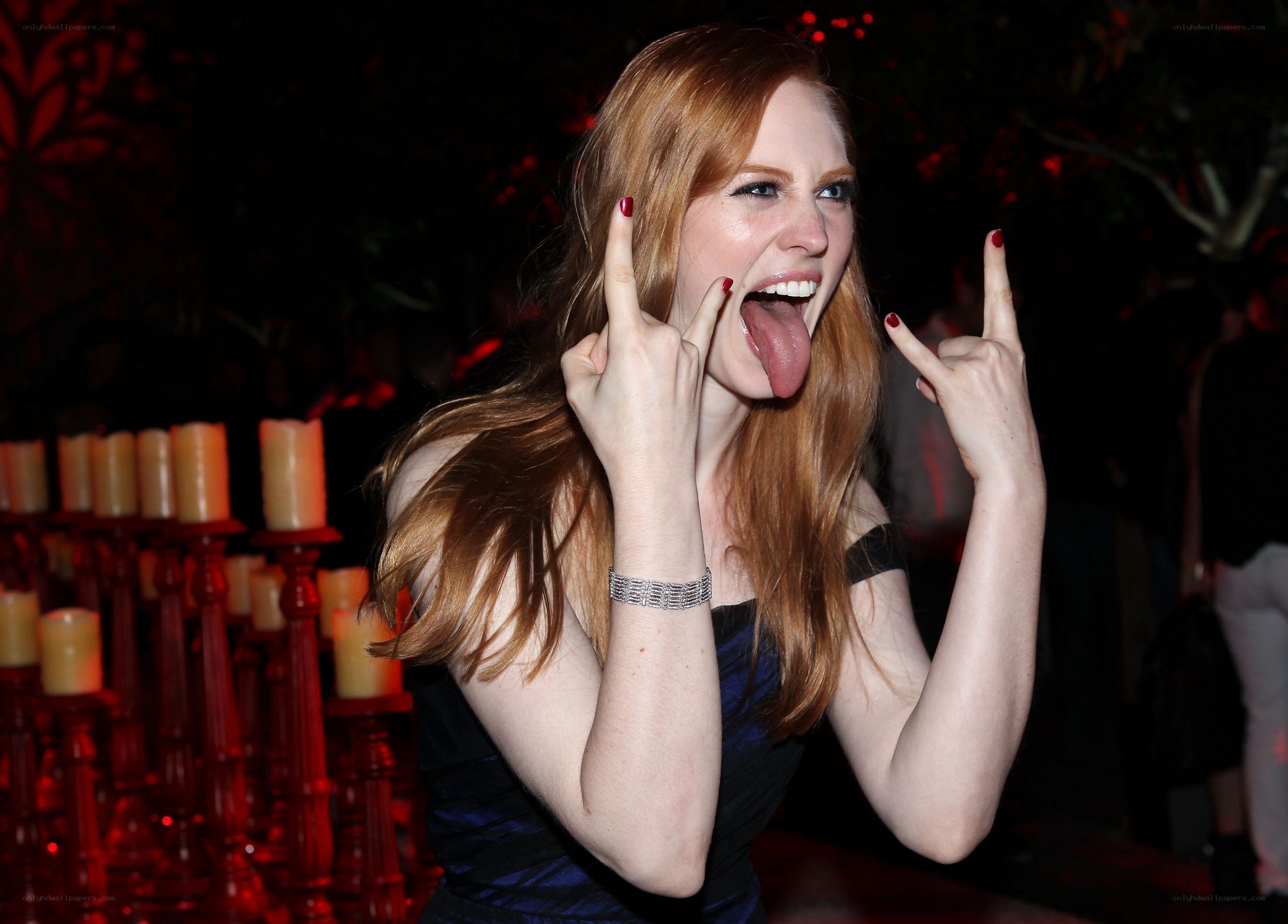 woman making rock gesture