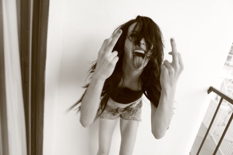 woman making rock-on gestures