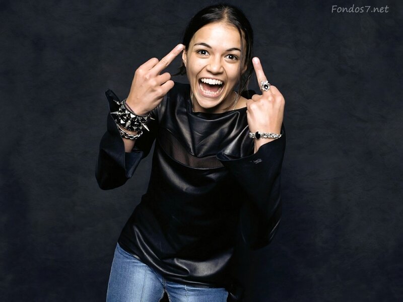 woman making rock-on gestures