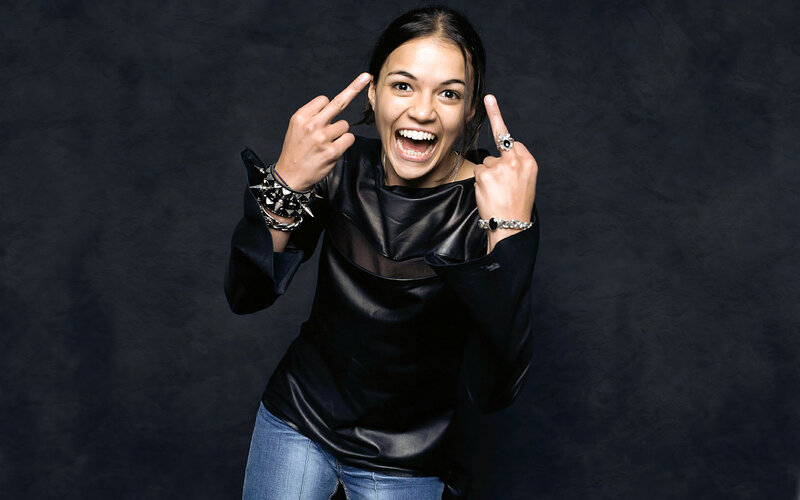 woman making rock-on gestures