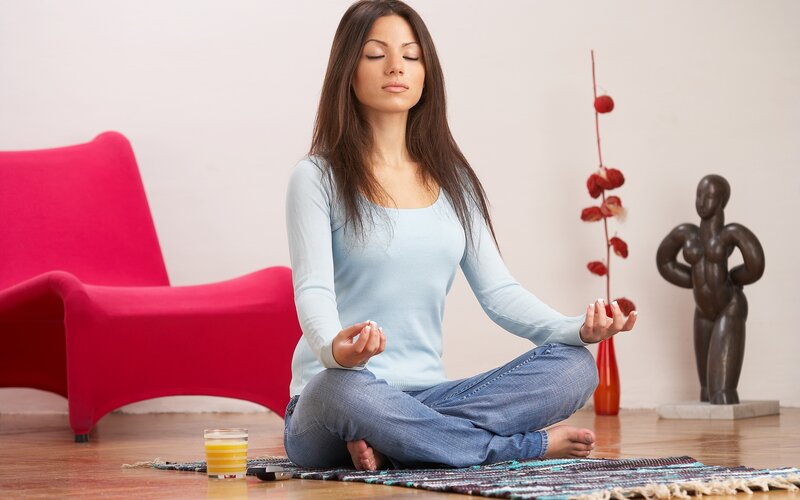 woman meditating at home