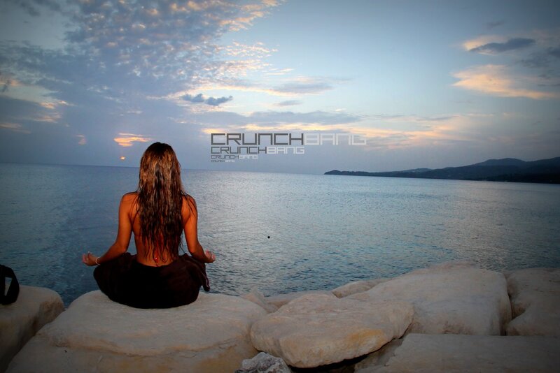 Woman meditating by the sea