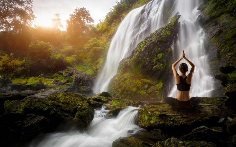Woman Meditating by Waterfall — Green