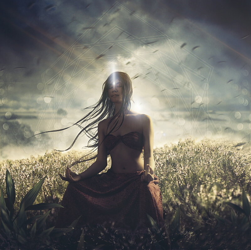 Woman Meditating in Field