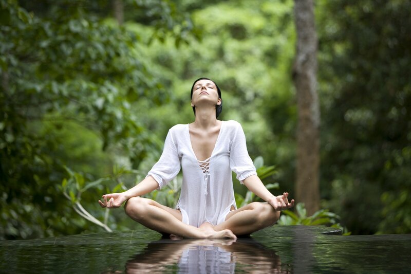 Woman Meditating in Forest — Green