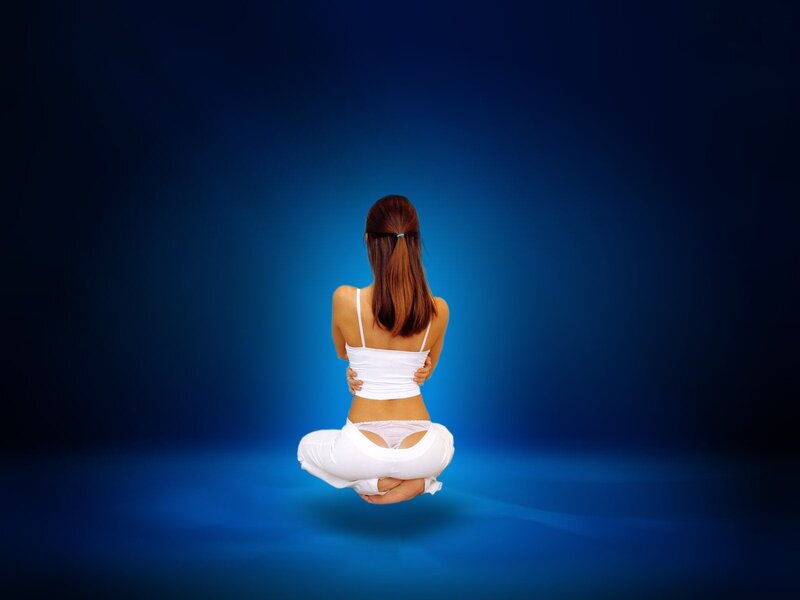 woman meditating in lotus position