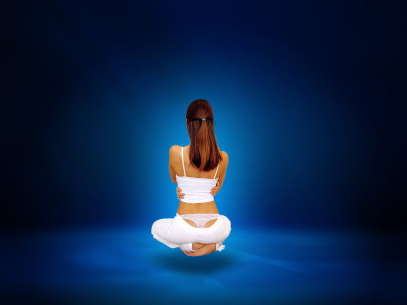 woman meditating in lotus position