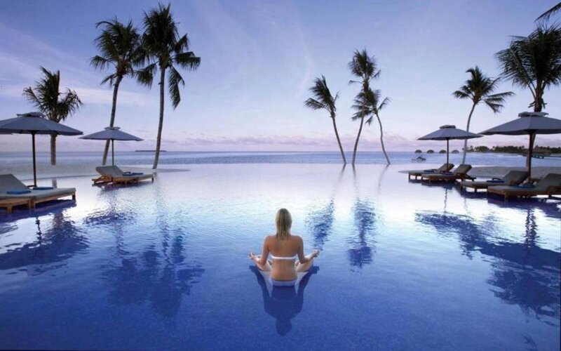 Woman Meditating in Pool — Blue