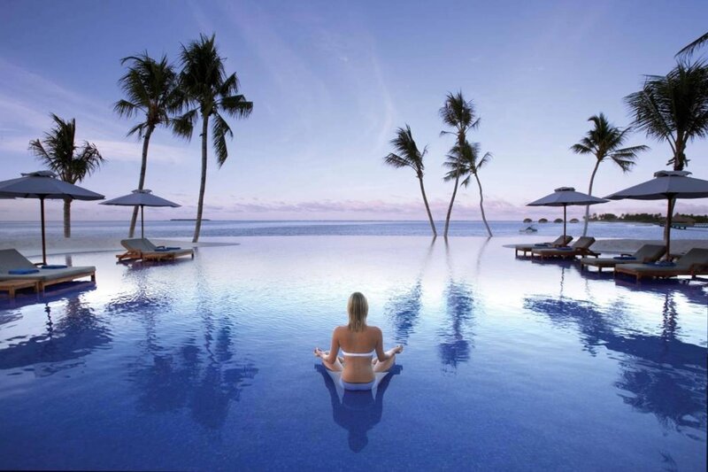 Woman Meditating in Pool