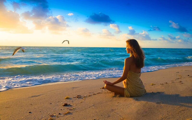 Woman Meditating on Beach — Blue