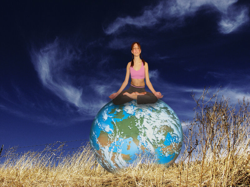 Woman Meditating on Globe
