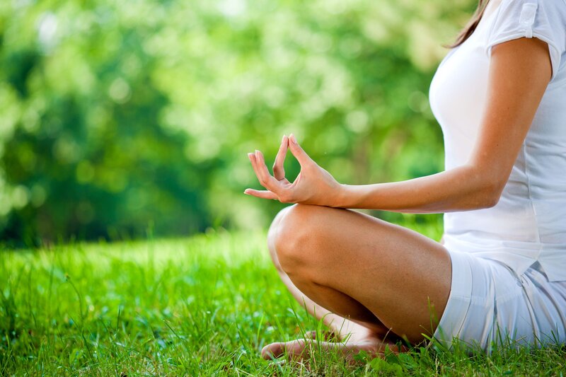 Woman Meditating on Grass — Green, Serene