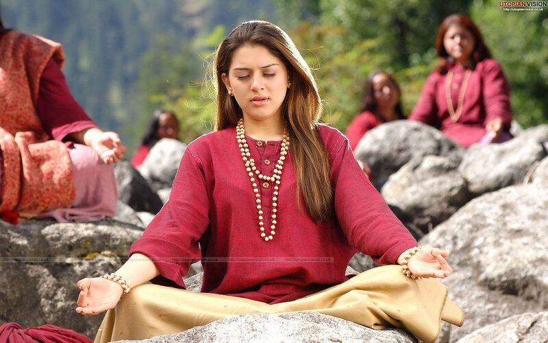 Woman Meditating on Rocks