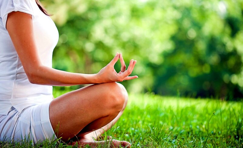 Woman Meditating Outdoors — Green