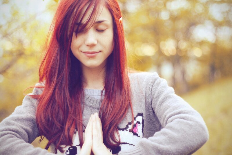 woman meditating outdoors