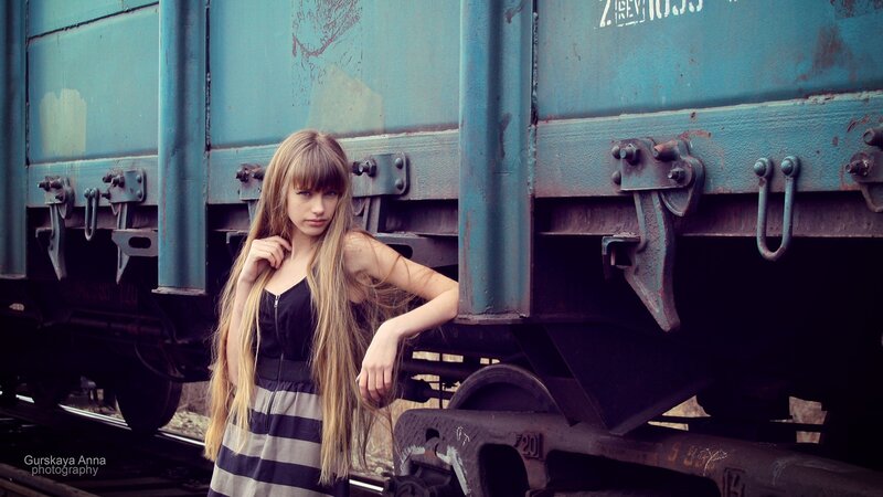 woman near blue train car