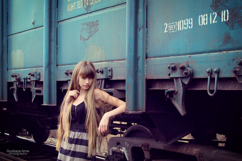 woman near blue train car