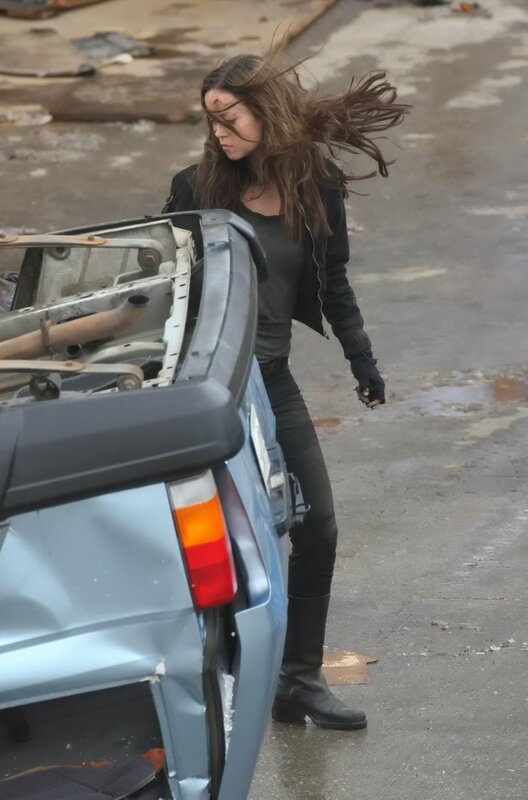 woman near damaged car
