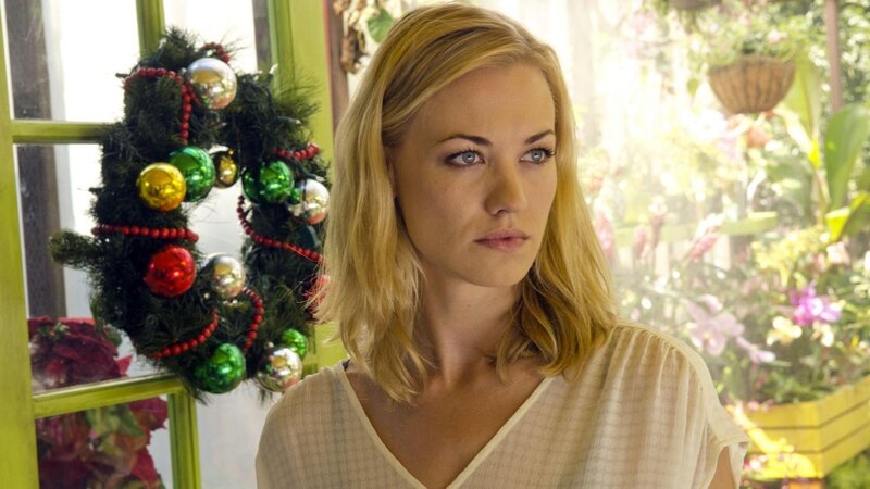 woman near holiday wreath
