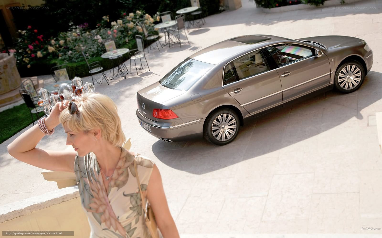 Woman near luxury sedan