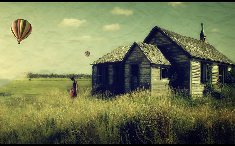 woman near old house with hot air balloons