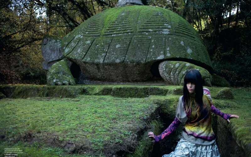 woman near turtle sculpture