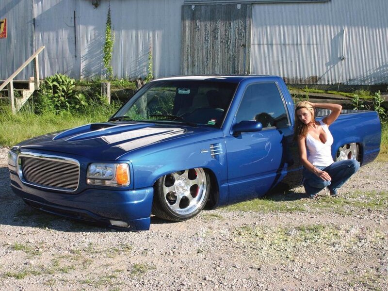Woman Next to Blue Truck