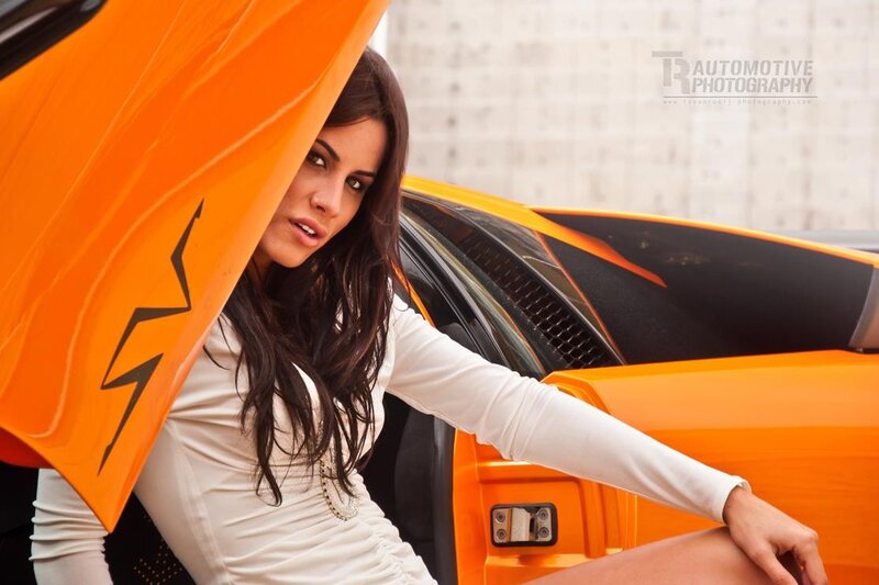 Woman Next to Orange Car — Dramatic, Afternoon