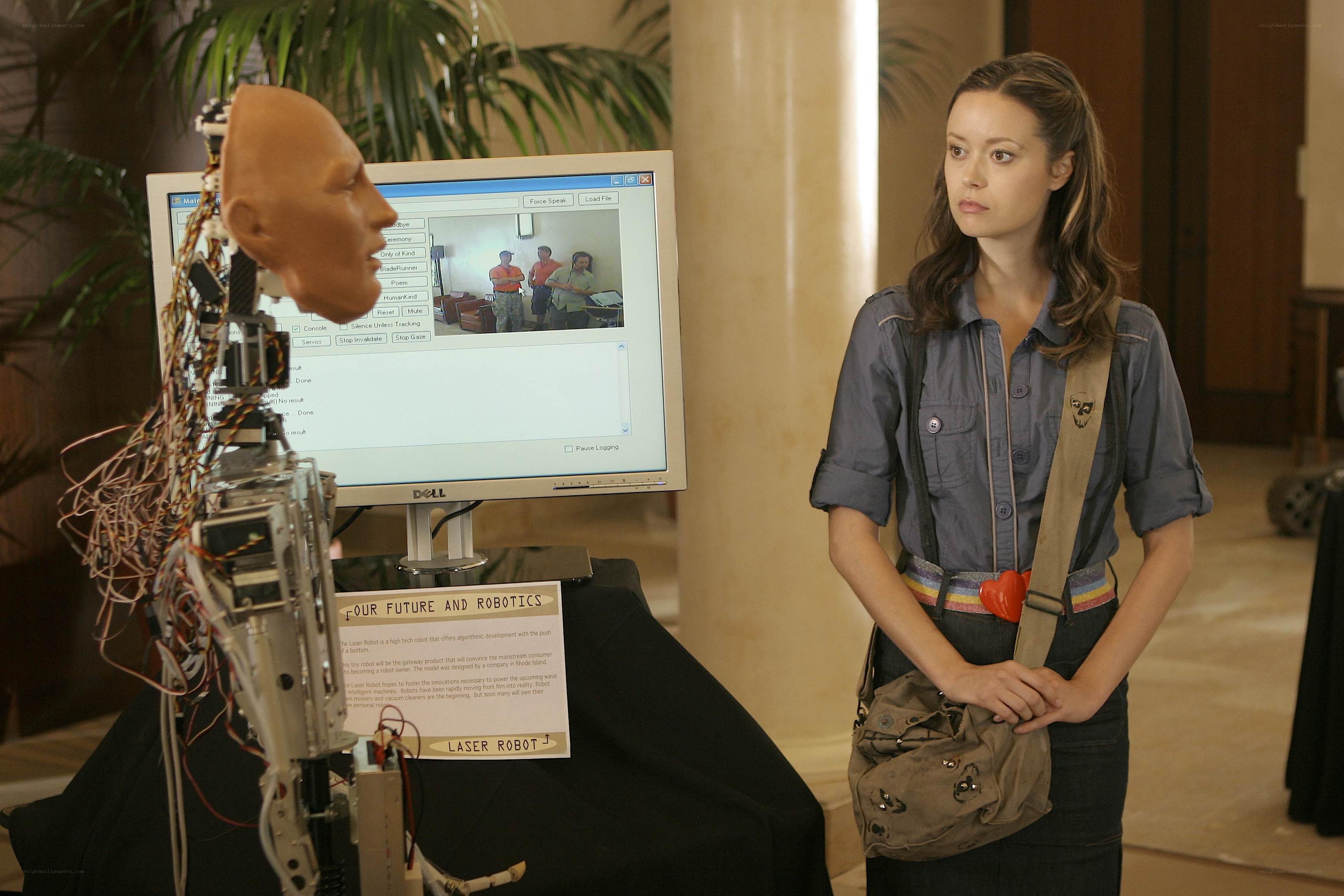 Woman observing robot display